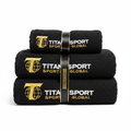 Three-piece black microfiber gym towel set with gold and white TITAN SPORT GLOBAL logo embroidery, banded together.