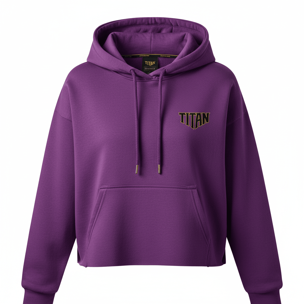 Purple cropped hoodie with matching drawstring, front kangaroo pocket, and black/gold TITAN logo on the chest.
