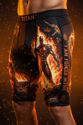 Titan compression shorts with a fiery warrior graphic and "I AM FORGED IN FIRE" motivational text on a dark background.