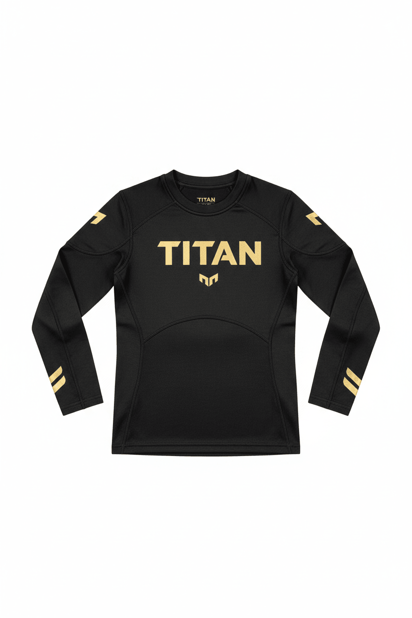 Black long-sleeve kids compression shirt with gold "TITAN" logo on chest, gold shoulder accents, and sleeve stripes.