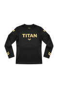 Black long-sleeve kids compression shirt with gold "TITAN" logo on chest, gold shoulder accents, and sleeve stripes.