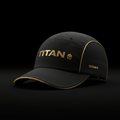 Black lightweight running cap with gold accents, metallic "TITAN" logo, and side mesh panels on a black background.