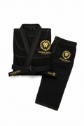 Black Titan Sport Global martial arts gi with gold lion logo embroidery, contrasting gold stitching, and black belt.