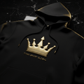 Matte black heavyweight hoodie with 3D gold crown emblem and TITAN SPORT GLOBAL logo on a black marble background.