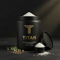 Black jar of Titan mixed plant protein with gold logo, open lid, scoop, and raw peas, lentils, and rice on table.