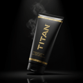 Matte black tube of Titan Muscle Recovery Cream with gold text and textured accents, surrounded by wisps of steam.