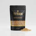 Black stand-up pouch with gold "TITAN" logo, containing organic chickpeas, with some spilled on the white surface.