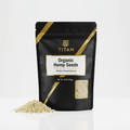 Black pouch of Titan Organic Hemp Seeds with gold accents, central white label, and clear window showing seeds.