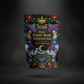 TITAN Organic Reishi Tea pouch with black background, gold crowns, colorful mushrooms, and floral folk-art design.