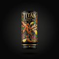 TITAN Organic Turmeric Shot 2oz bottle with ornate gold, fruit, and crown graphics on a matte black background.