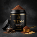 Black TITAN Pea Protein jar with gold logo, chocolate powder, scoop, and chocolate pieces on a dark stone surface.