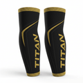 Black TITAN performance compression sleeves with gold trim, logo, and curved accent detailing on a white background.