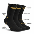 Three black TITAN performance crew socks with gold logo, labeled with features like cushioned sole and arch support.