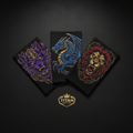 Three black TITAN performance headbands featuring detailed wolf, dragon, and lion graphic prints in purple, blue, red.