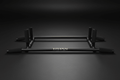 Matte black TITAN Pro pull-up bar with foam-padded grips and gold logo, centered on a dark studio background.
