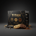 Black and gold TITAN Sport protein cookie variety pack with cookies, peanuts, and chocolate chips on a dark surface.