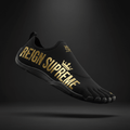 Black five-finger barefoot shoe featuring gold "REIGN SUPREME" text and crown logo against a dark background.