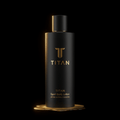 Matte black bottle with gold logo and text, labeled TITAN Sport Body Lotion, standing in a pool of golden liquid.