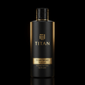 Matte black TITAN SPORT body wash bottle with gold accents and logo against a dark background.