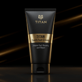 Black tube of TITAN Sport Foot Cream with gold accents and branding, centered on a dark reflective surface.