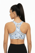TITAN Sports Bra Diamond Ice racerback featuring a blue geometric diamond print, gold crown logo, and branded hem.