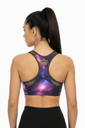 TITAN Galaxy Crown sports bra: racerback design with purple galaxy print, gold crown graphic, and black trim.