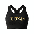 Black bandeau sports bra with cross-back straps, gold TITAN SPORT GLOBAL logo, and geometric mesh pattern detail.