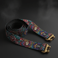 TITAN 8ft yoga strap with colorful lion, crown, and rose graphic print on dark background with gold metal buckles.
