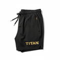 Black TITAN 7-inch training shorts with elastic drawstring waist, gold zipper pocket, and gold metallic logo.