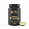 Black tub of Titan Vegan Pre-Workout with gold text, "Green Apple" label, and a sliced green apple on a white base.