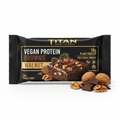 Black packaging for Titan Vegan Walnut Protein Brownie, featuring 18g protein text, brownie graphic, and whole walnuts.