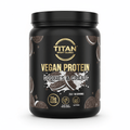 Black tub of TITAN Vegan Protein, Cookies & Cream flavor, with gold text, cookie illustrations, and milk splashes.