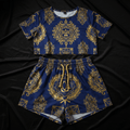Royal blue women’s lounge set with metallic gold crown and wreath print. Includes crop top and drawstring shorts.