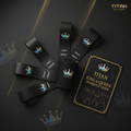 TITAN Crown Edition black resistance bands with holographic crown logos, a mesh carry bag, and workout guide booklet.