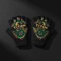 Black fingerless lifting gloves featuring a green coiled snake graphic, gold ornate detailing, and Titan branding.
