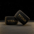 Two black heavy-duty wrist wraps with a textured finish, featuring prominent metallic gold "TITAN" branding.