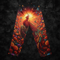 TITAN lounge pants featuring a vibrant phoenix, sun, marigolds, and hummingbirds in a rich orange and teal color palette.