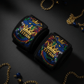 Black Titan wrist wraps with embroidered blue dragon, gold crown logo, and colorful accents on dark background.